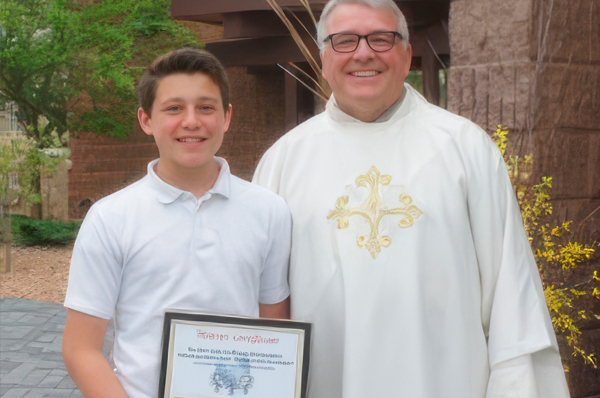 Deacon Mickey Friesen with Emil